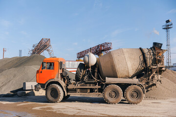 Banner cement factory, concrete loading to Mixer truck on manufacturing plant - obrazy, fototapety, plakaty