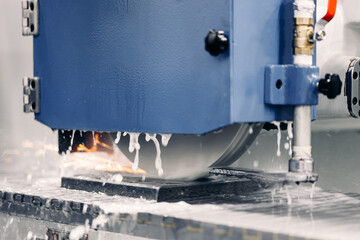 Concept metalworking industry, finish metal working on horizontal surface grinder machine with...