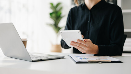  businesswoman or accountant hand typing laptop working to calculate.