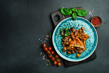traditional Azerbaijani food. Lamb liver stewed with vegetables and spices. Free space for text. On a dark background.