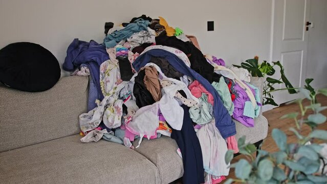 Heap of Dry Laundry Clothes before Ironing and Folding