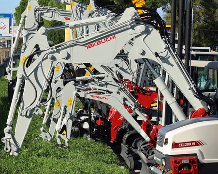 Pradamano, Italy. November 4, 2023. Takeuchi excavator booms in a row outside the official dealership. 