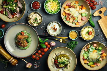 Food. Set of dishes on the table. On a dark stone background. free space for text.
