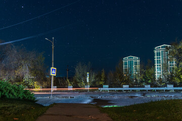 Starry sky in the city. Panoramic view. Ukrainian city under the stars. Natural night view in the...