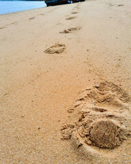 Footprints in the sand on the beach, Thailand. Nature background