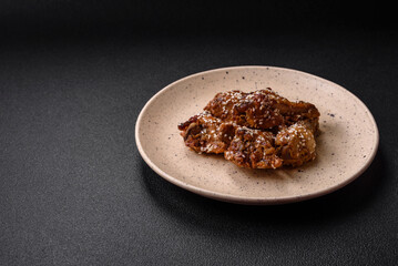 Delicious grilled chicken wings with salt, spices and teriyaki sauce