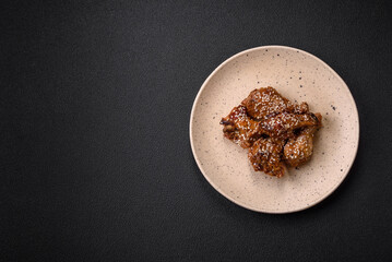 Delicious grilled chicken wings with salt, spices and teriyaki sauce