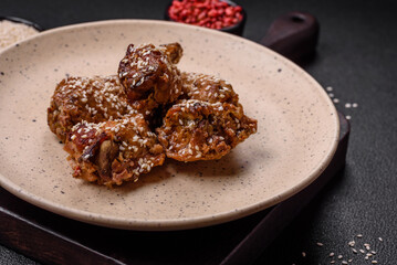 Delicious grilled chicken wings with salt, spices and teriyaki sauce