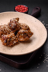 Delicious grilled chicken wings with salt, spices and teriyaki sauce