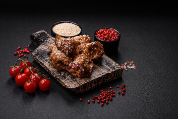 Delicious grilled chicken wings with salt, spices and teriyaki sauce