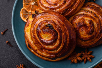 Delicious baked cinnamon raisin rolls in the form of rolls