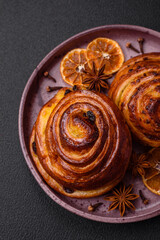 Delicious baked cinnamon raisin rolls in the form of rolls