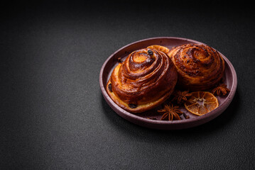 Delicious baked cinnamon raisin rolls in the form of rolls