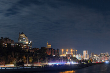 Fototapeta na wymiar Starry sky in the city. Panoramic view. Ukrainian city under the stars. Natural night view in the city of Dnepr. Background image.