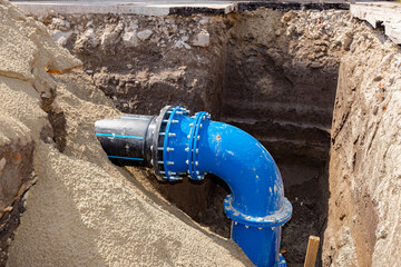 Fragment of pipeline, couplings with bolts, elbow of the water supply network