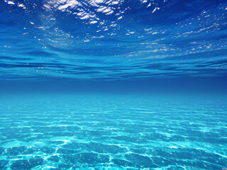 Bottom under the sea, submerged in clean, bluish waters, reflection of the sea.