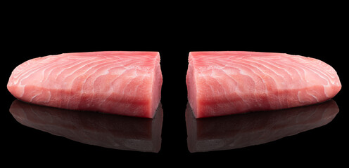 Yellow fin tuna steak isolated on black background. Fresh rare tuna steak isolated. Raw yellowfin...