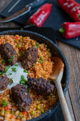 Balkan cuisine with homemade serbian djuvec rice and cevapcici