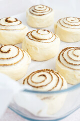 Raw, unbaked cinnamon buns resting. Cooking of healthy buns from alternative flours. Vegan bread....