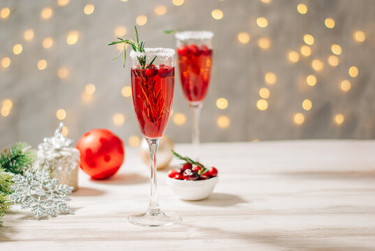Cranberry red mimosa celebration beverage with sparkling wine Christmas or New year celebration drink