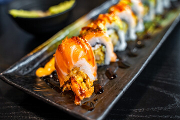 Close-up of Rainbow rolls in the Japanese restaurant. 