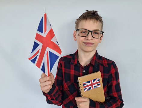 Teenager child with UK flag and books