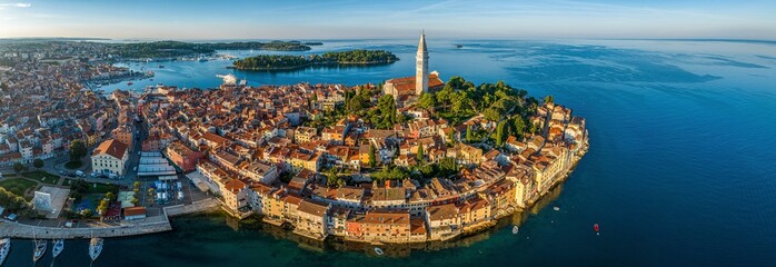 Drone image of the historic Croatian coastal town of Rovinj during sunrise - obrazy, fototapety, plakaty
