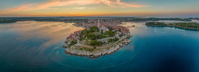 Drone image of the historic Croatian coastal town of Rovinj during sunrise - obrazy, fototapety, plakaty