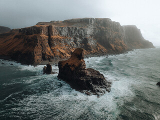 waves against the cliffside 
