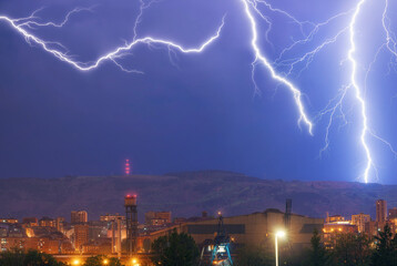 Lightning storm with views of the mountain and the city