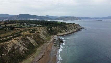 Bird views of the beach from the stone cliffs