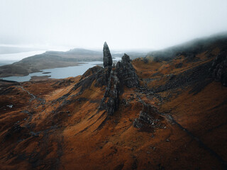 scottish mountains with fog and lake