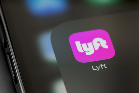 Lyft mobile icon app on a screen smartphone iPhone closeup. Lyft - Taxi aggregator, public company based in San Francisco. Batumi, Georgia - September 16, 2023