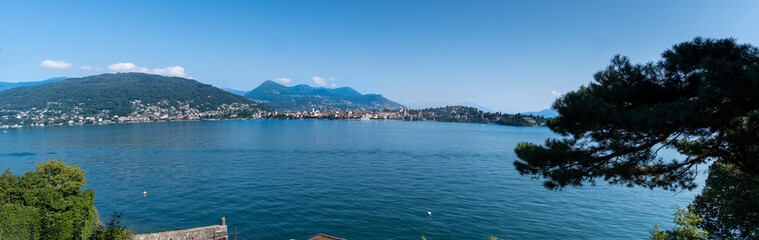 Fototapeta na wymiar Large panoramic view of Lago Maggiore Lake from the one of Borromean islands - Isola Bella, Northern Italy