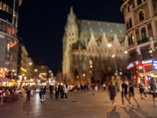 Fototapeta na wymiar Crowd of anonymous people walking on busy city street at night , urban city life background