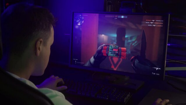 Gamer winning the round of the multiplayer online war simulator. Gamer winning against opponents in the online warfare battle. Gamer deactivating the enemy bomb to win an online match.