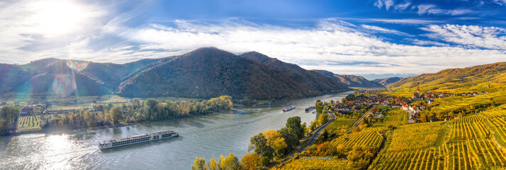 Autumn panorama of Wachau valley (Unesco world heritage site) with ships on Danube river near the...