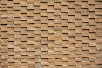 Photo of an old empty brick background for design. A red brick wall.