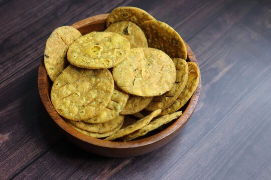 Crispy and crunchy methi mathri is a popular tea time snack in north India. It's especially popular during the Diwali festive season. It's a savory cracker or Masala puri. Copy Space.