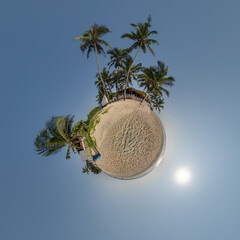 coconut trees in jungle in Indian tropic village on sea shore on little planet in blue sky,...