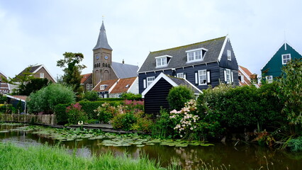 Fototapeta na wymiar church on the river in summer