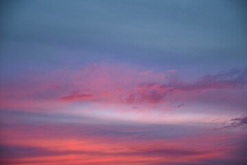 Naklejka na ściany i meble Stunning blue, purple and pink sunset sky background
