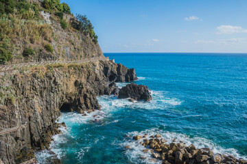 Fototapeta premium Pathway with mountain fence next to the Mediterranean Sea, Riomaggiore ITALY