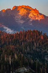 An orange mountain peak of Sierra Nevada mountains viewed from Moro Rock in Sequoia National Park...