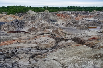 Ural Mars. An extraordinarily beautiful summer landscape with red lakes, colorful slopes and forest. A picturesque mountain range. Natural landscape, impressive sky. Nature of the Urals. 4K