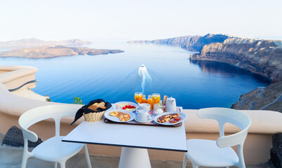 breakfast for two with coffee, fresh orabge juice and yogurt at morning by seaside