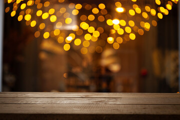 Empty dark wooden table in front of restaurant abstract blurred bokeh background. Can be used to...