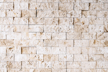 Natural light beige stone decoration material tile background, limestone stone wall texture