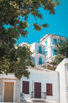 Stunning view of residential houses in pristine white in the idyllic island of Skopelos in Greece
