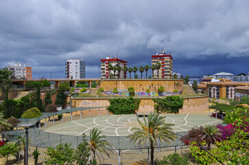Street city view with cars and traffic, house facades cityscape skyline of Huelva, Spain Cristopher...